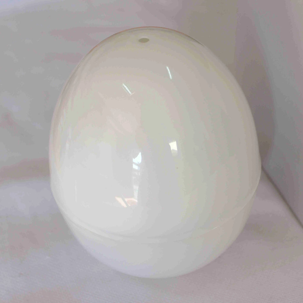 White microwave egg cooker with capacity for four eggs and food-grade construction