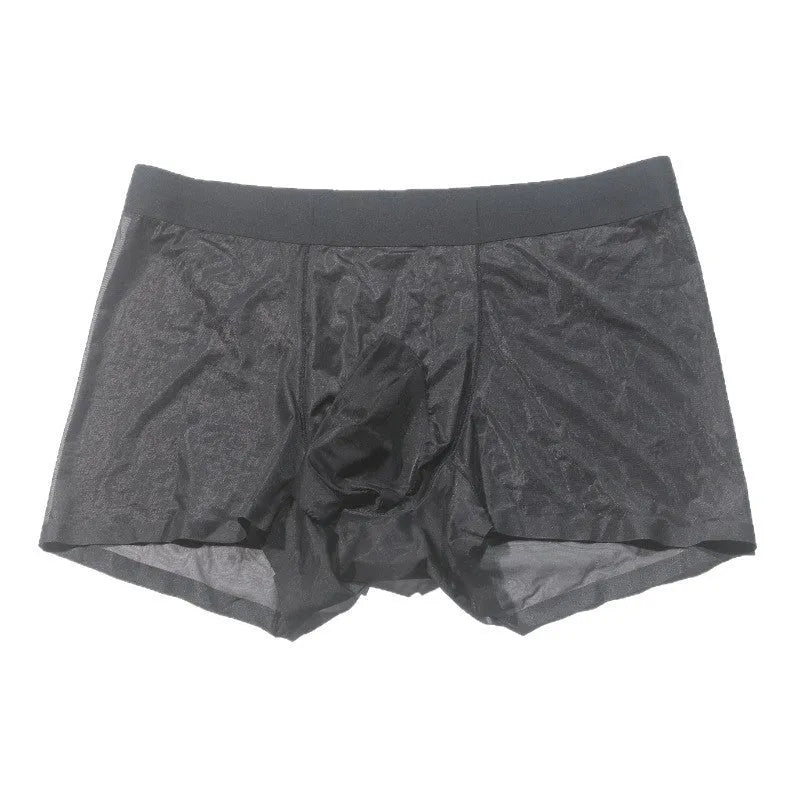 Plus size transparent nylon underwear shorts in skin colour on a hanger, showing seamless mid-waist design.
