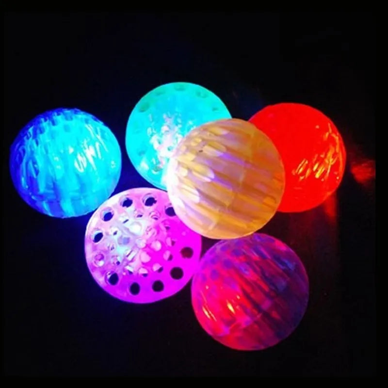 Blue solid honeycomb TPR pet toy ball with luminous flash on a white background