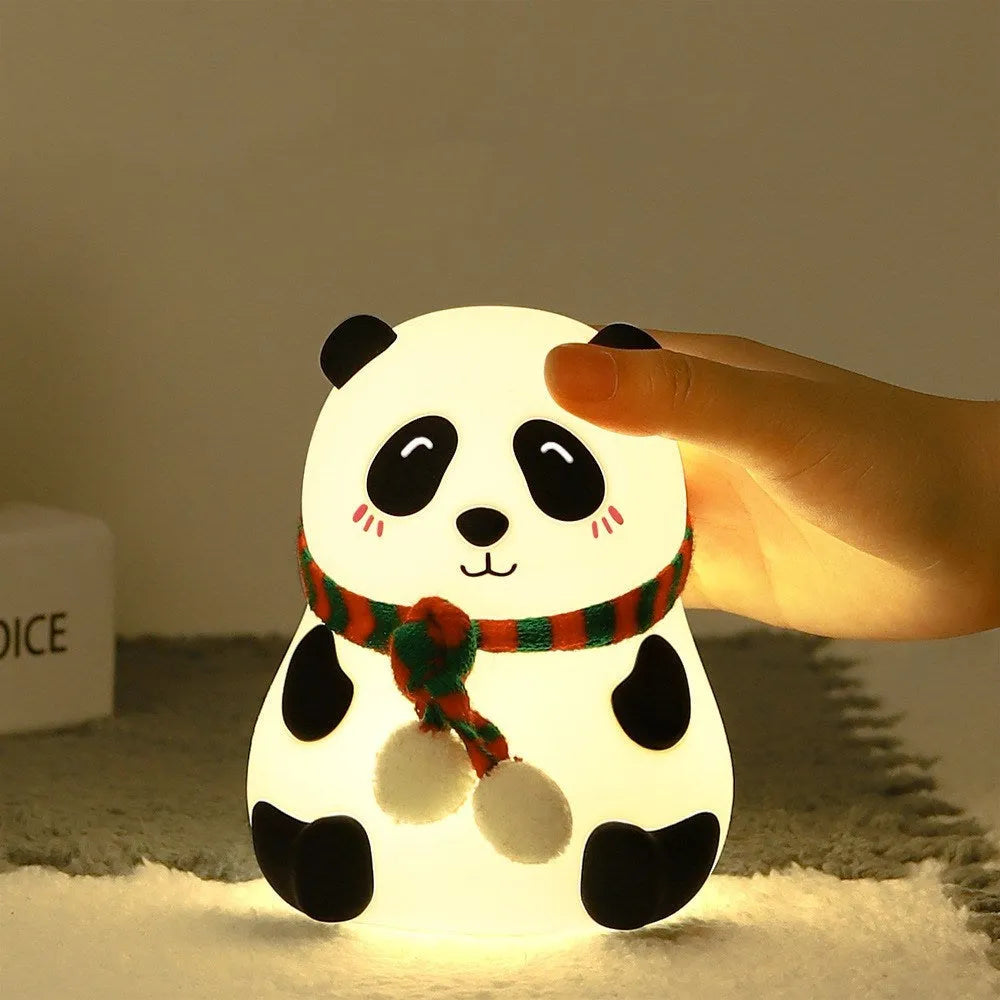 Panda-shaped silicone and ABS night light with soft glow, shown with USB charging cable.