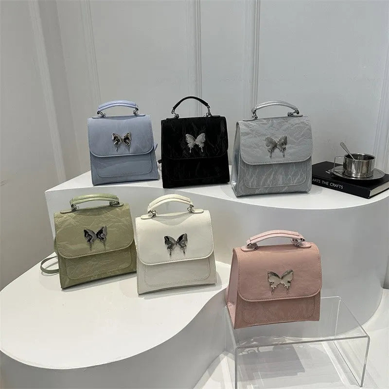 Preppy style women's backpack handbag in PU leather with bow detailing and six colour options
