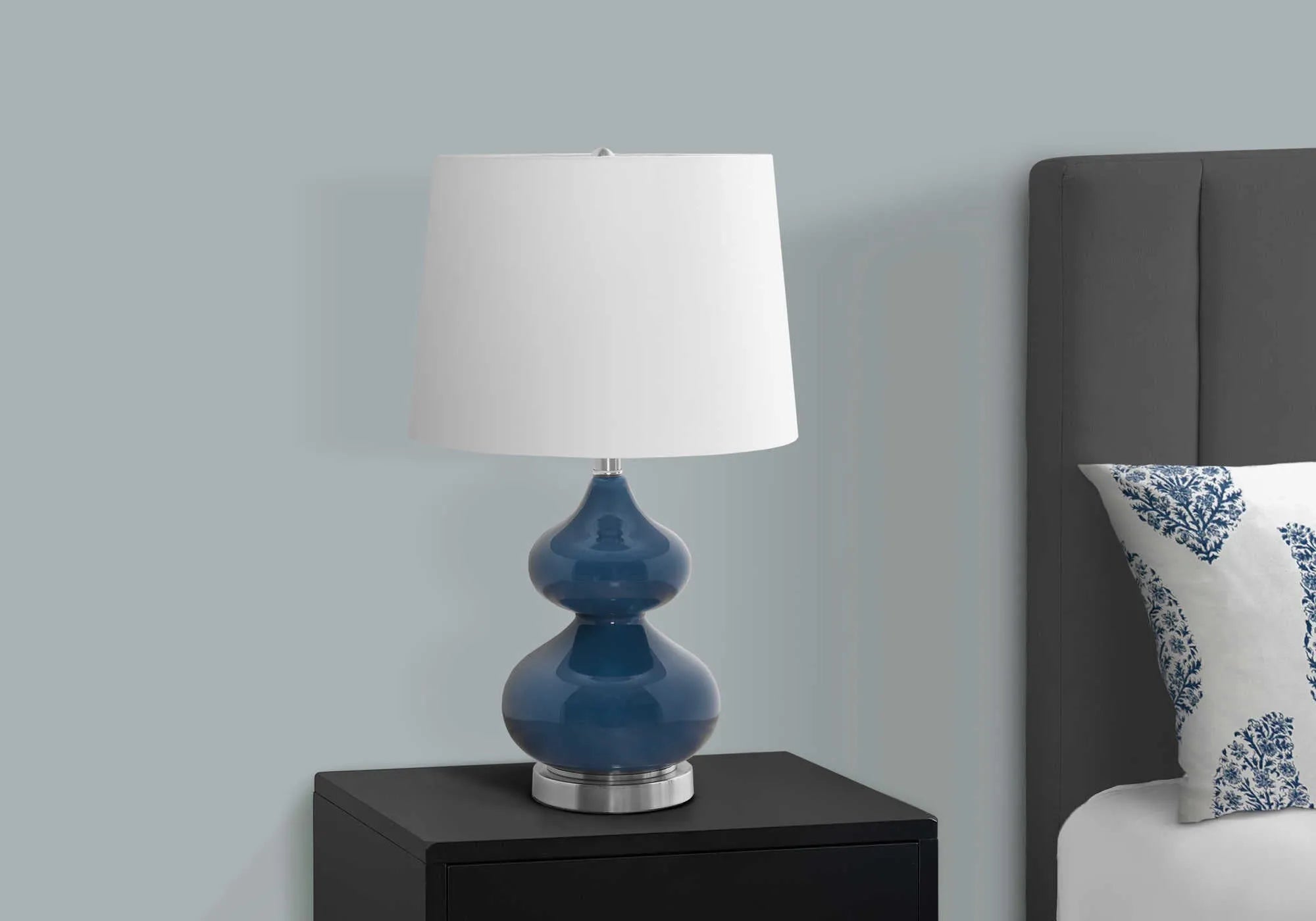 Blue crystal glass desk lamp with white fabric shade for a child's bedroom.