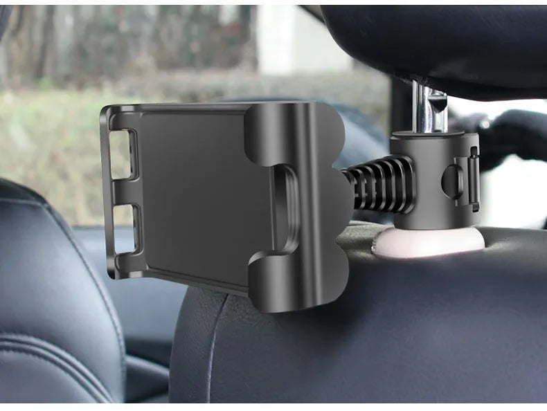 Black universal car headrest mount holding a tablet, showing 360-degree rotation and extendable arm.