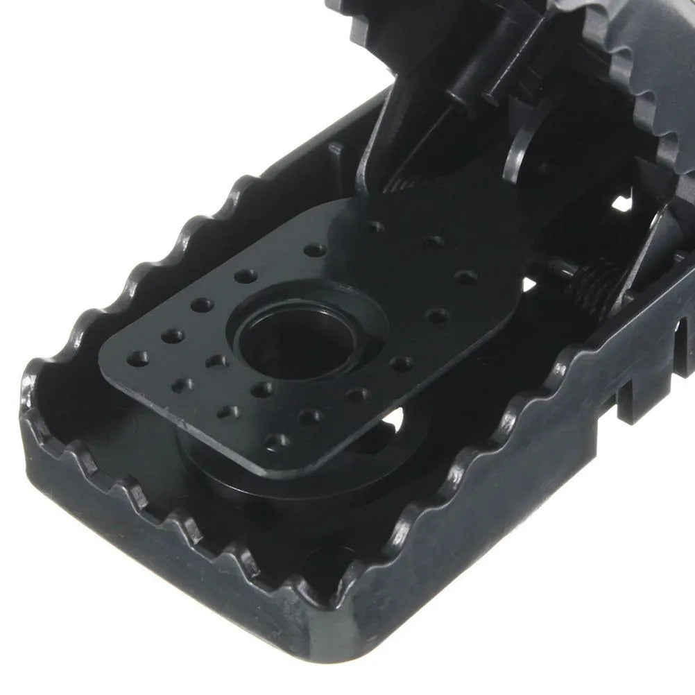 Six black plastic snap mousetraps showing dimensions and smooth surface.