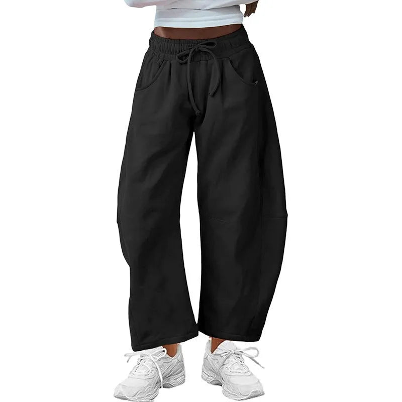 Women's loose cropped sweatpants in cotton fabric with elastic drawstring waistband in street fashion styling