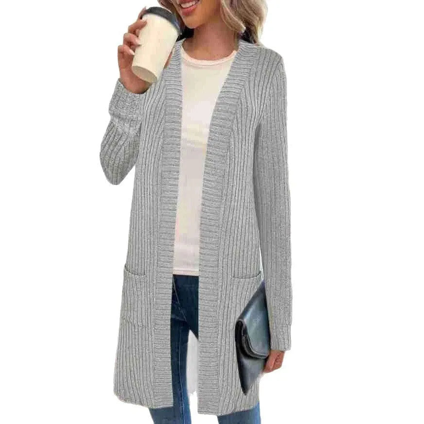 Women's plus size black knitted cardigan jacket with long sleeves and front pockets.
