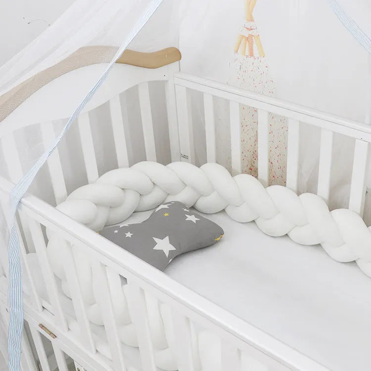 Spandex crystal velvet baby cot bumper in grey pink colour, shown flexible and long.