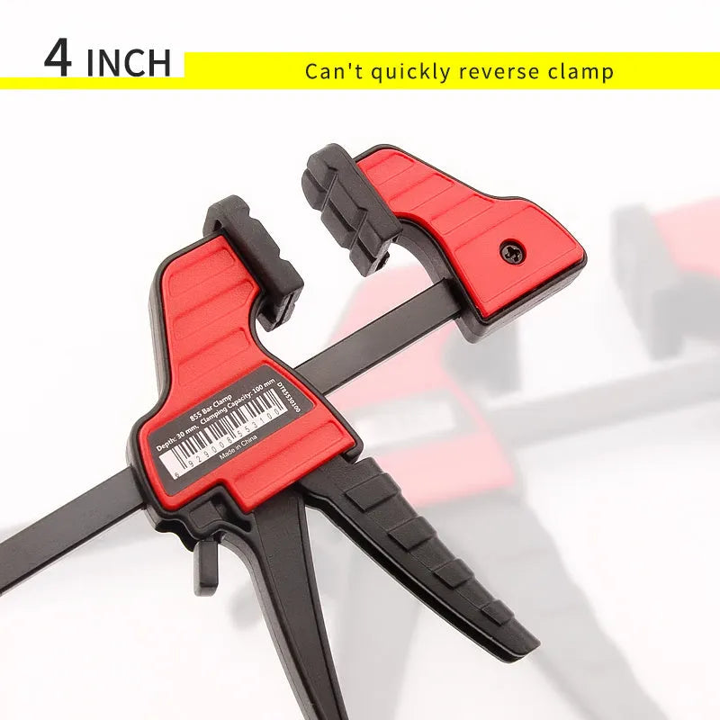 Black plastic woodworking toggle clamp with quick-release mechanism and soft rubber protective pads