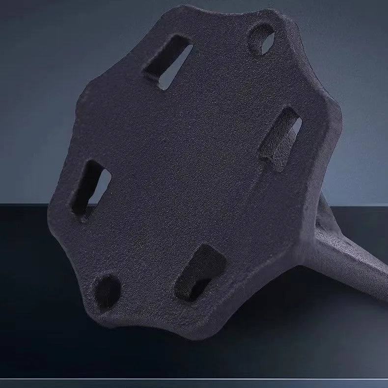 Small square cast iron wood splitter tool on a wooden background.
