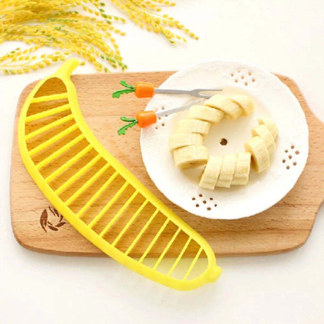 Yellow banana slicer made from food-grade PP plastic on a light background