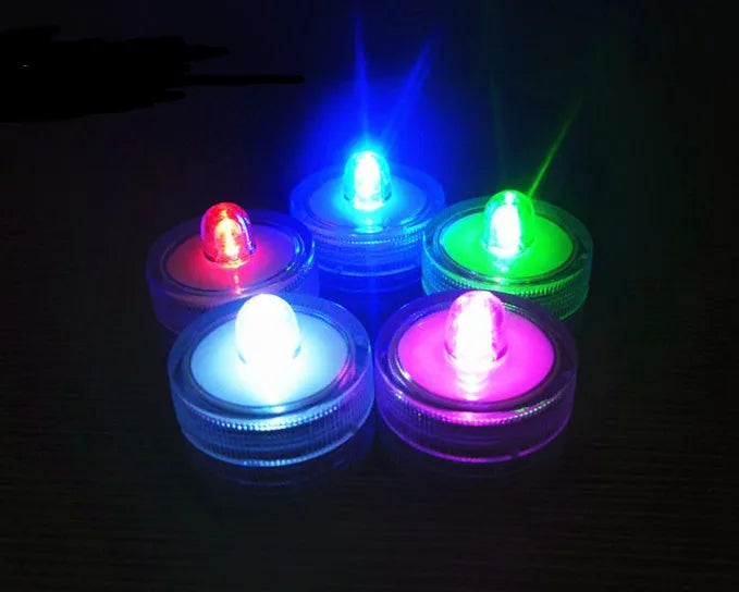LED waterproof electronic candle light in seven colours, 3cm diameter, 2.6cm height, plastic body, 12-pack