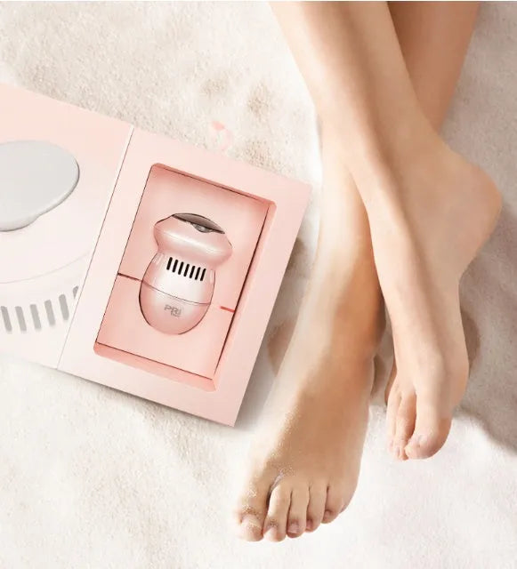 Beige and white electric foot file grinder with USB cable and grinding heads