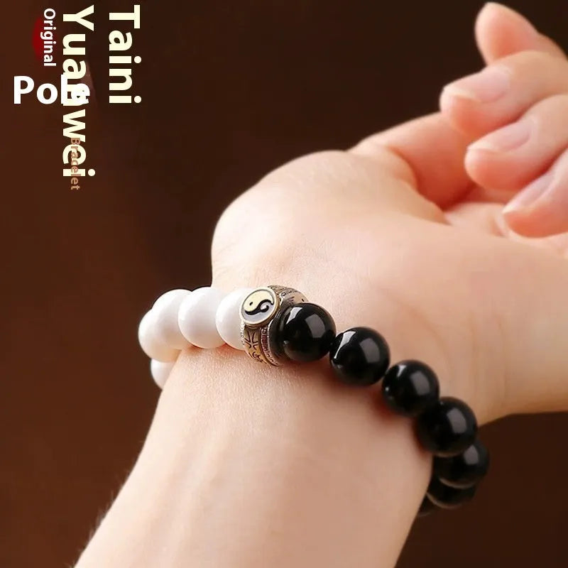 Black and white obsidian tai chi bracelet with 10mm geometric beads and bodhi mantra design