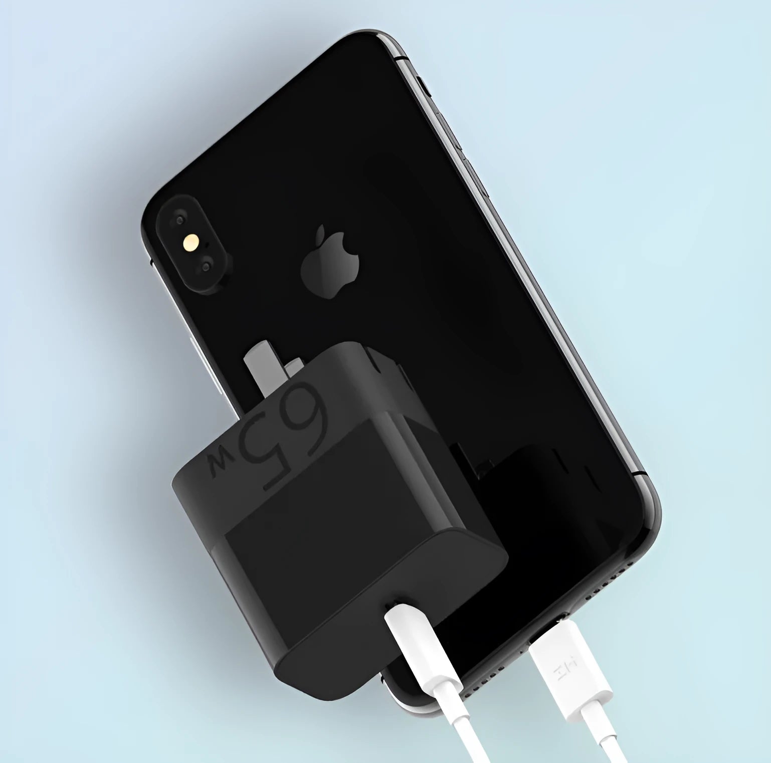 Black ZMI USB-C 65W GaN laptop power adapter showing compact size