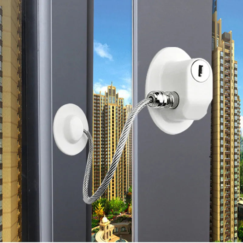 White window security chain lock with 18cm steel cable and locking head on a window frame