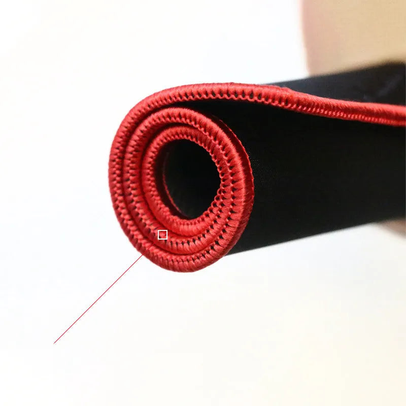 Black rubber gaming desk mat showing textured surface and 5mm thickness