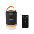Black rechargeable IPX6 LED camping light with remote control, hanging hook and top magnet on white background