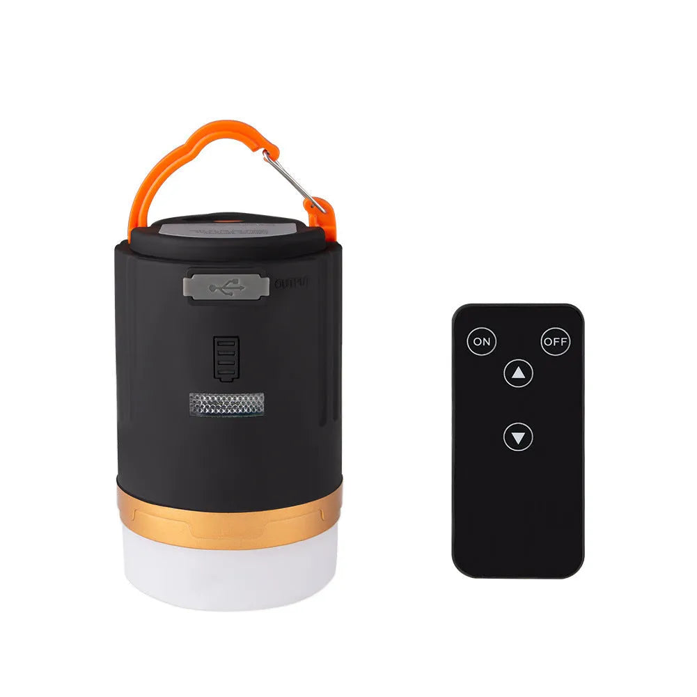 Black rechargeable IPX6 LED camping light with remote control, hanging hook and top magnet on white background