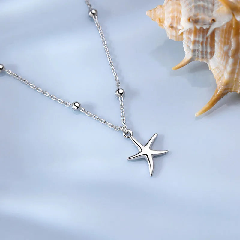 Women's sterling silver anklet with a starfish charm on a delicate chain.