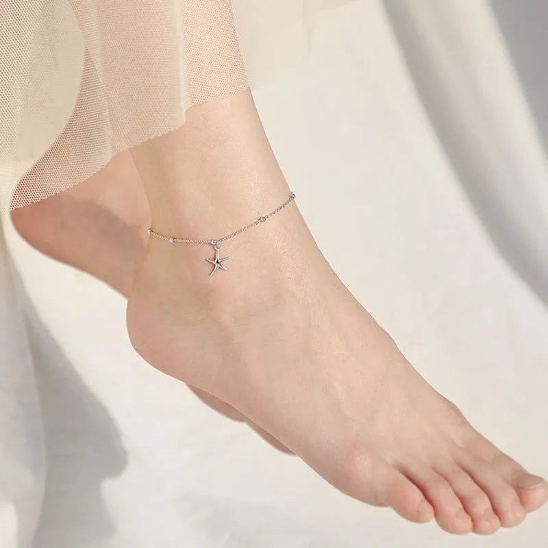 Women's sterling silver anklet with a starfish charm on a delicate chain.
