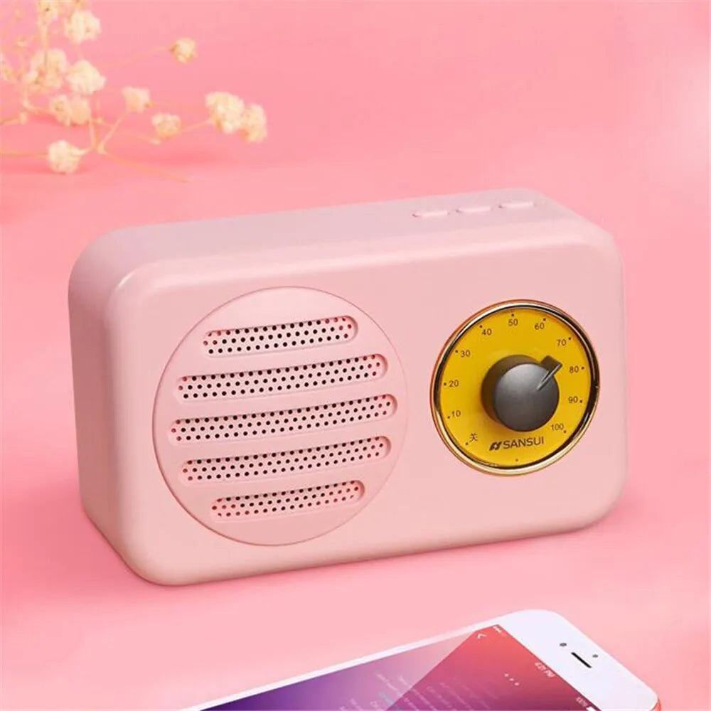 Compact portable Bluetooth speaker in wood colour finish with FM radio and USB cable.