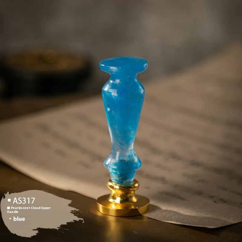 Wooden wax seal handle tool showing various style options like lily, owl platform, and Roman column designs.