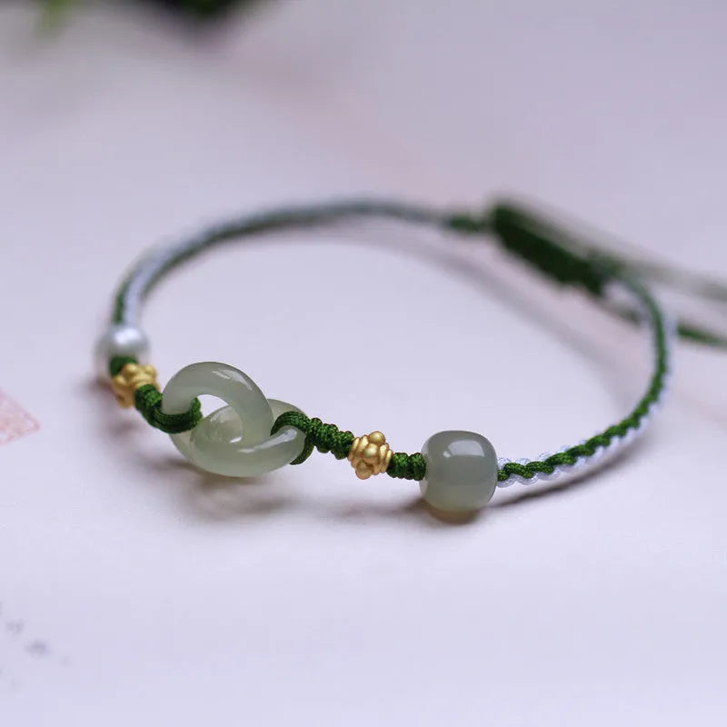 DIY woven bracelet with Hetian jade beads on a flexible wire band with silver or gold metal fittings.