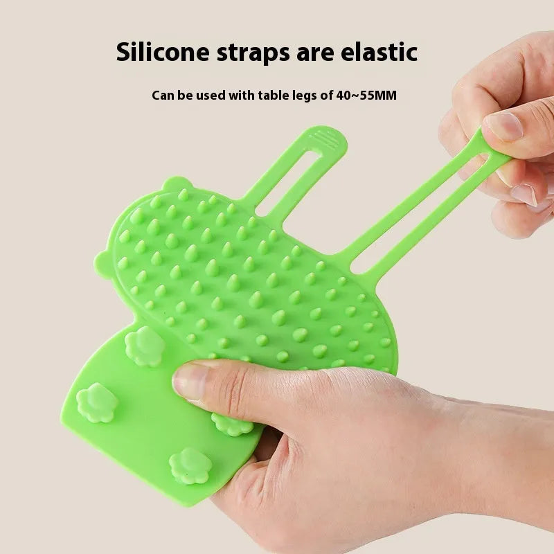 Silicone cat grooming comb with rounded teeth and adjustable strap for table mounting