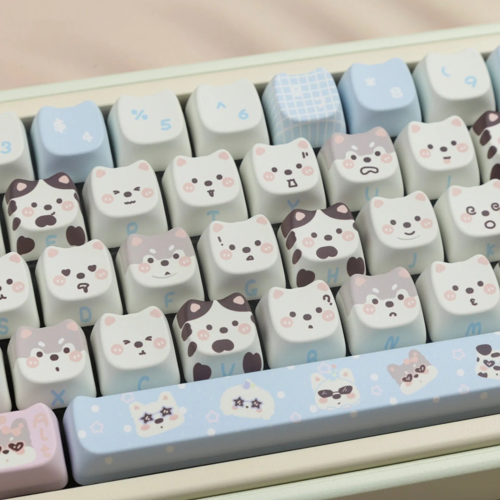 Full set of colourful PBT keyboard keycaps with sublimated cute puppy and cat designs laid out.