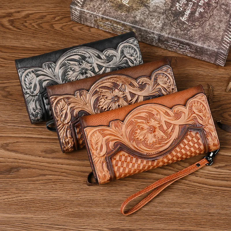 Women's brown tri-fold leather wallet with an embossed floral pattern, shown open to reveal compartments.