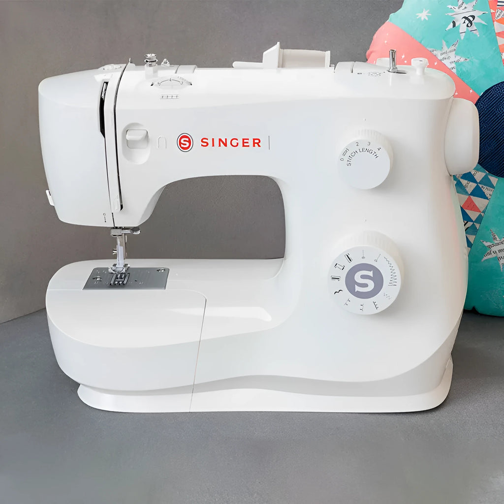 M2405 portable electric sewing machine with accessories on tabletop