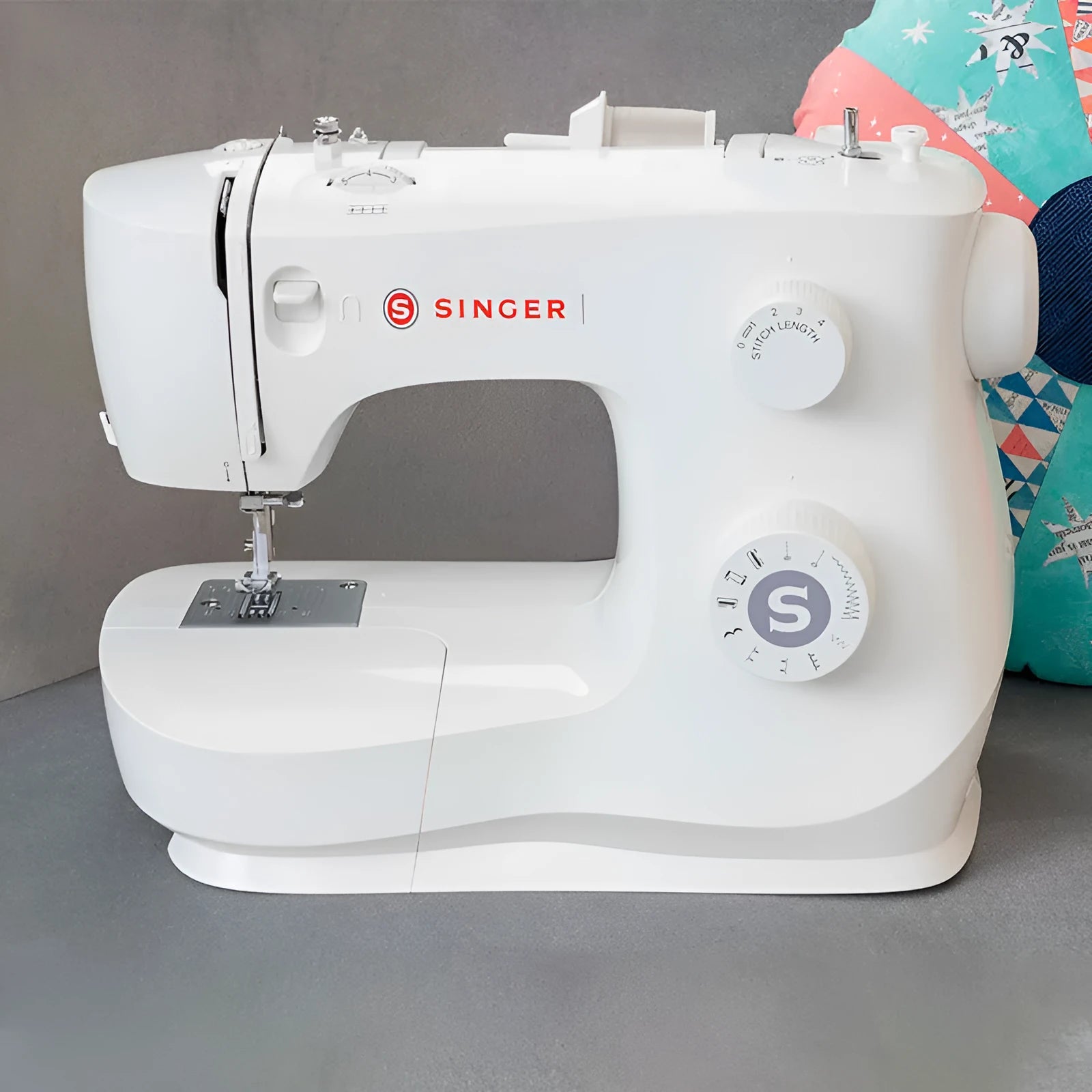 M2405 portable electric sewing machine with accessories on tabletop