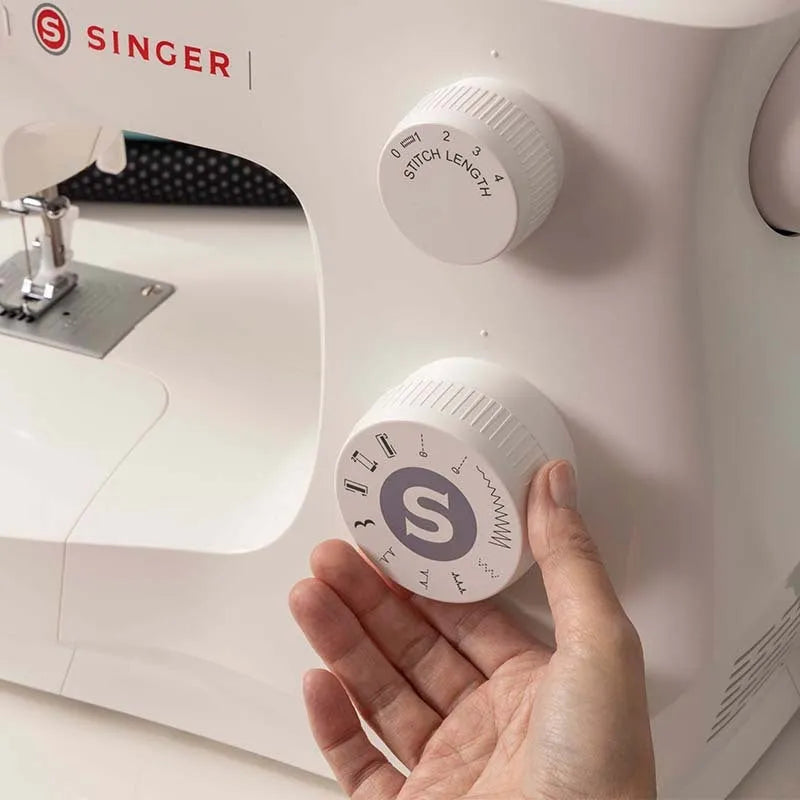 M2405 portable electric sewing machine with accessories on tabletop