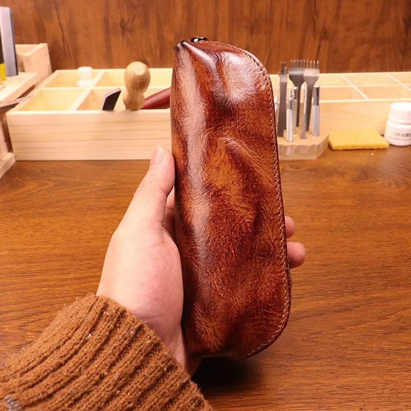 Leather glasses buggy bag in first layer cowhide with belt clip, shown in black, burgundy, brown or light brown.