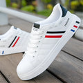 Unisex black sports shoes on a white background, showing the sole, with a sizing chart for codes 39 to 44 visible.