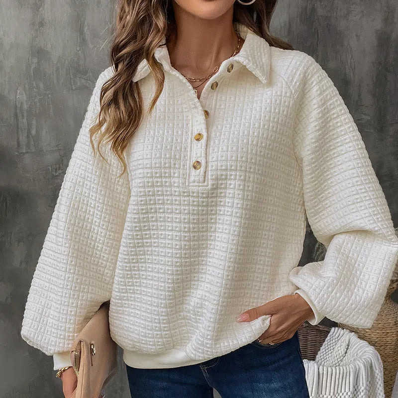 Women's beige thick polo collar long sleeve sweater laid flat.
