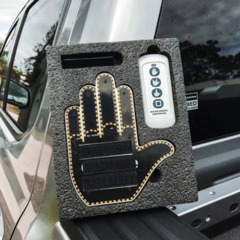 Black LED gesture car light with amber illumination showing hand gesture, remote control, and 3M Velcro mounting