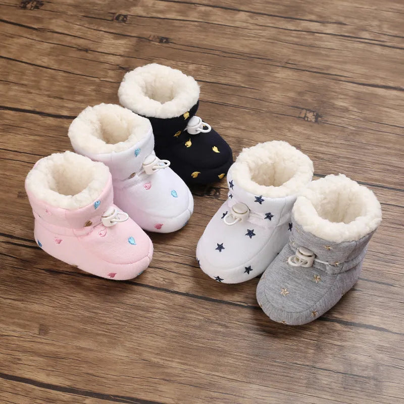 Baby autumn winter cotton shoes with tall crown, elastic band, non-slip sole, in black and white, dark blue, gray, or pink.