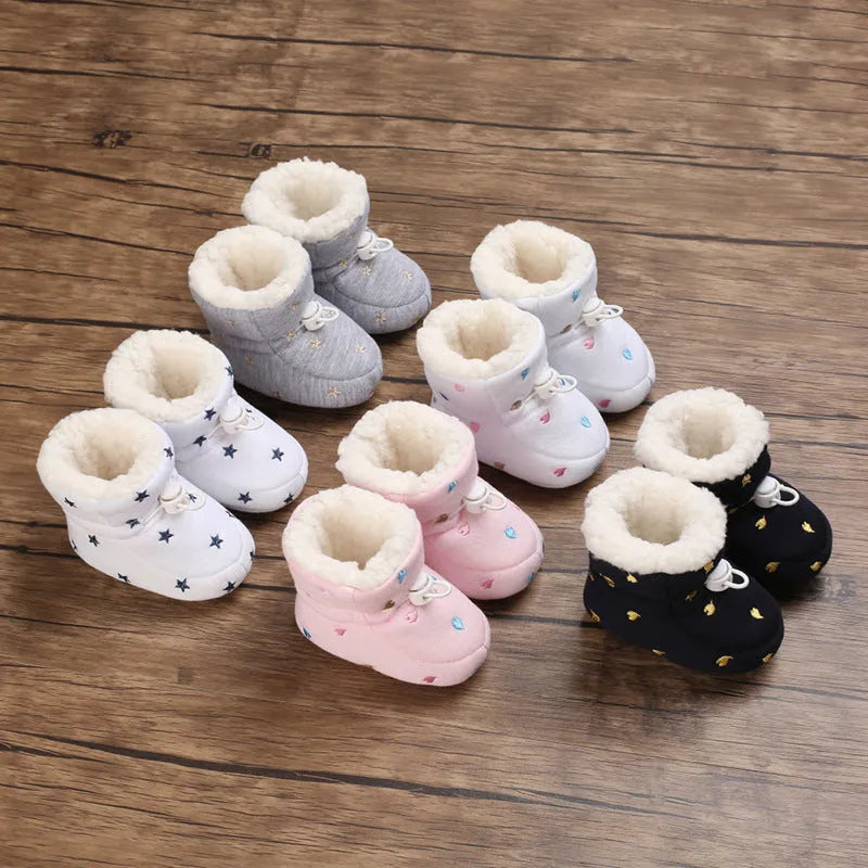 Baby autumn winter cotton shoes with tall crown, elastic band, non-slip sole, in black and white, dark blue, gray, or pink.