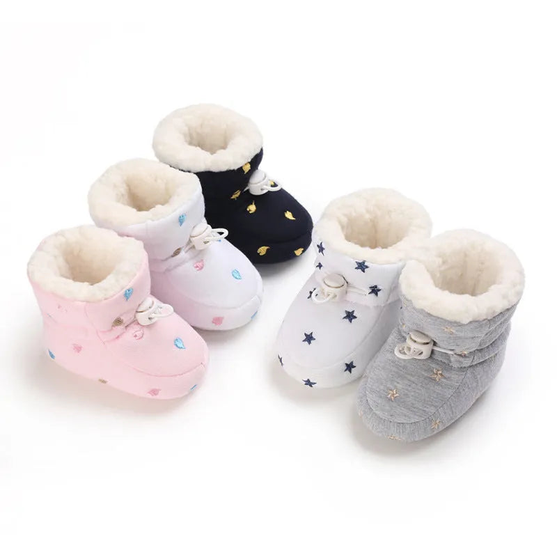 Baby autumn winter cotton shoes with tall crown, elastic band, non-slip sole, in black and white, dark blue, gray, or pink.