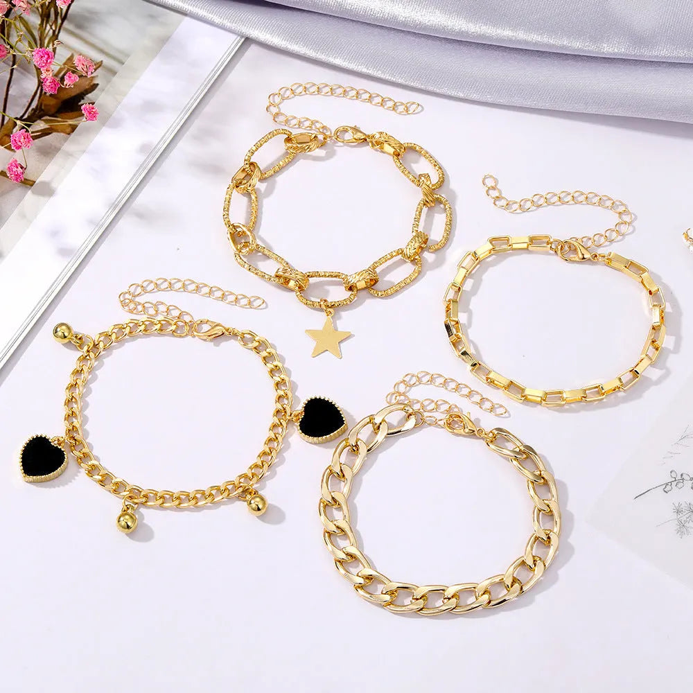 Black peach heart bracelet with multi-layer alloy chain, five-pointed star and heart charms, retro simple design