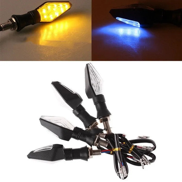 Motorcycle LED turn signal lights showing yellow and blue double-sided luminous indicators