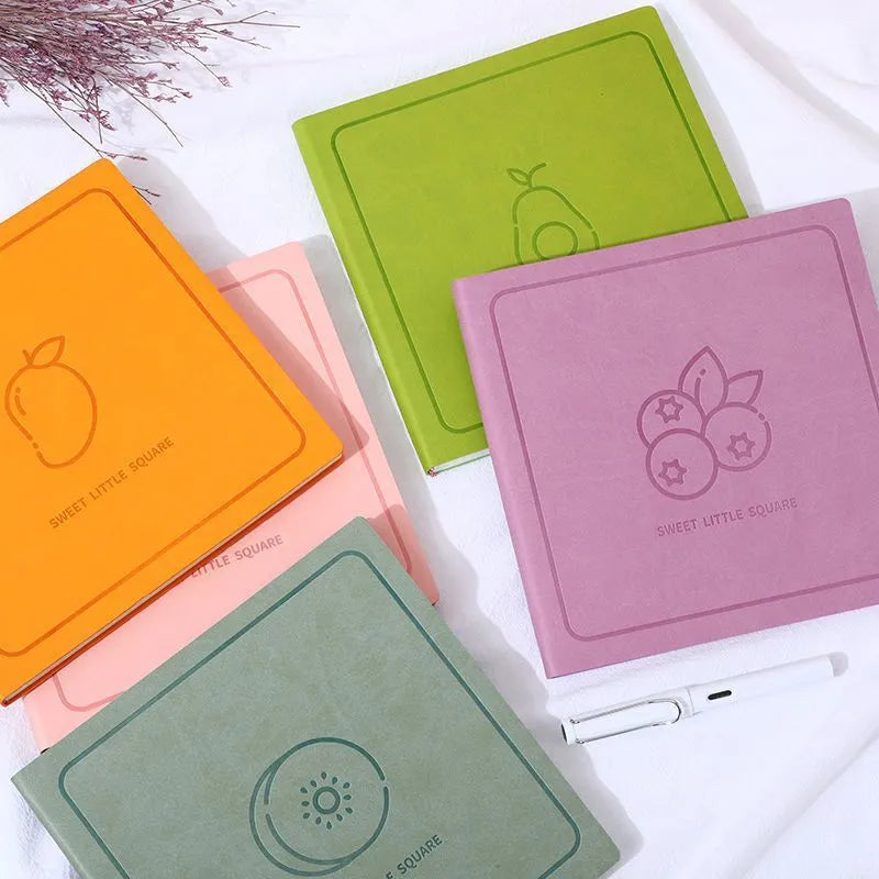 Square faux leather mesh notebook in avocado green with French fold binding and blank pages.