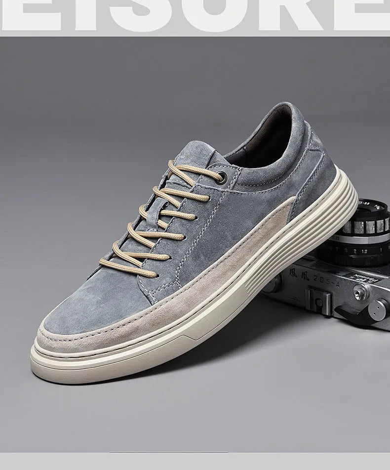 Men's grey pigskin leather casual skate shoes with round toe and flat rubber sole on a light background.