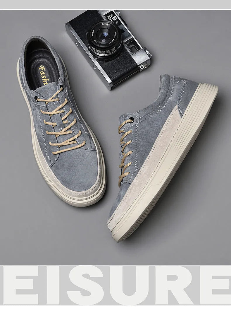 Men's grey pigskin leather casual skate shoes with round toe and flat rubber sole on a light background.
