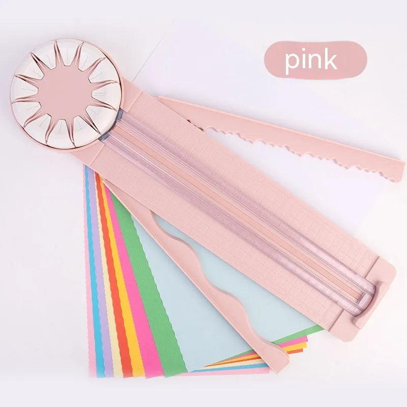 Pink and black 12-in-1 multifunctional plastic paper cutting machine on a desk