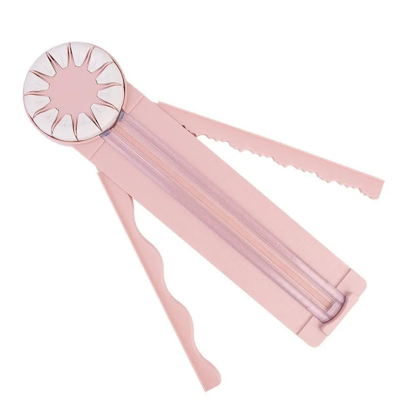 Pink and black 12-in-1 multifunctional plastic paper cutting machine on a desk