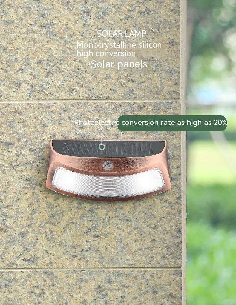Solar outdoor wall light with smiling face design for garden decoration