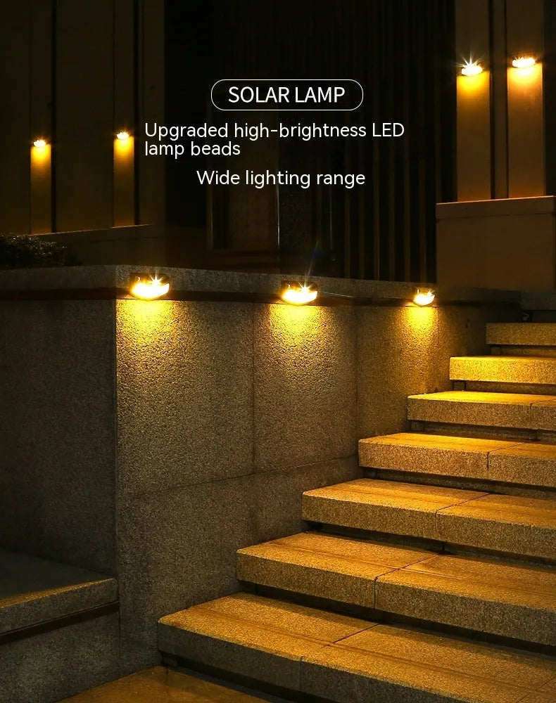 Solar outdoor wall light with smiling face design for garden decoration