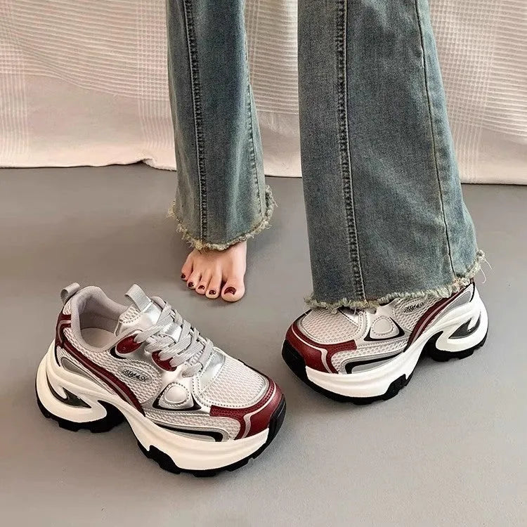 Women's red and silver clunky platform sneakers with mesh lining and rubber sole.
